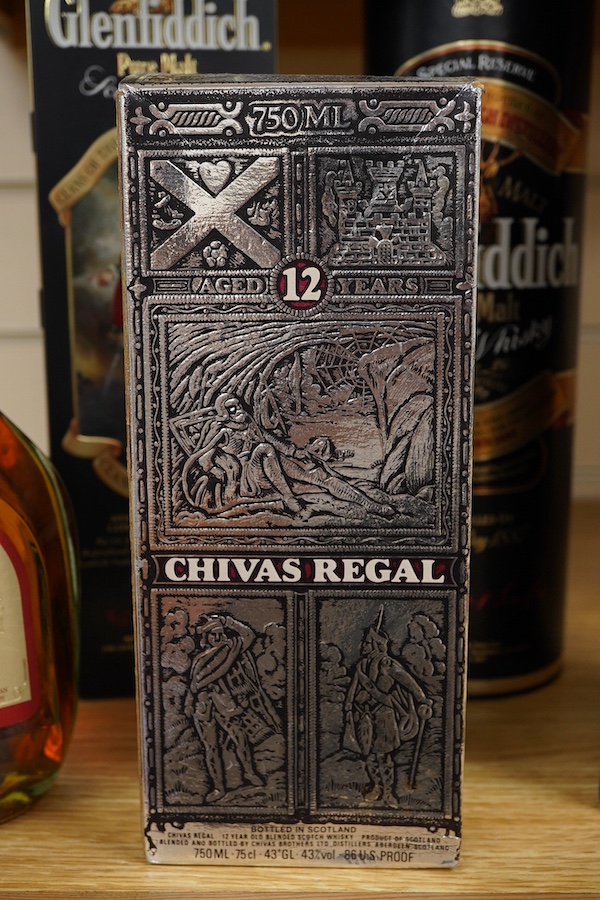 Four bottles of Whisky to include The Glenlivet 12 years aged single malt and two bottles of Glenfiddich, together with a bottle of brandy